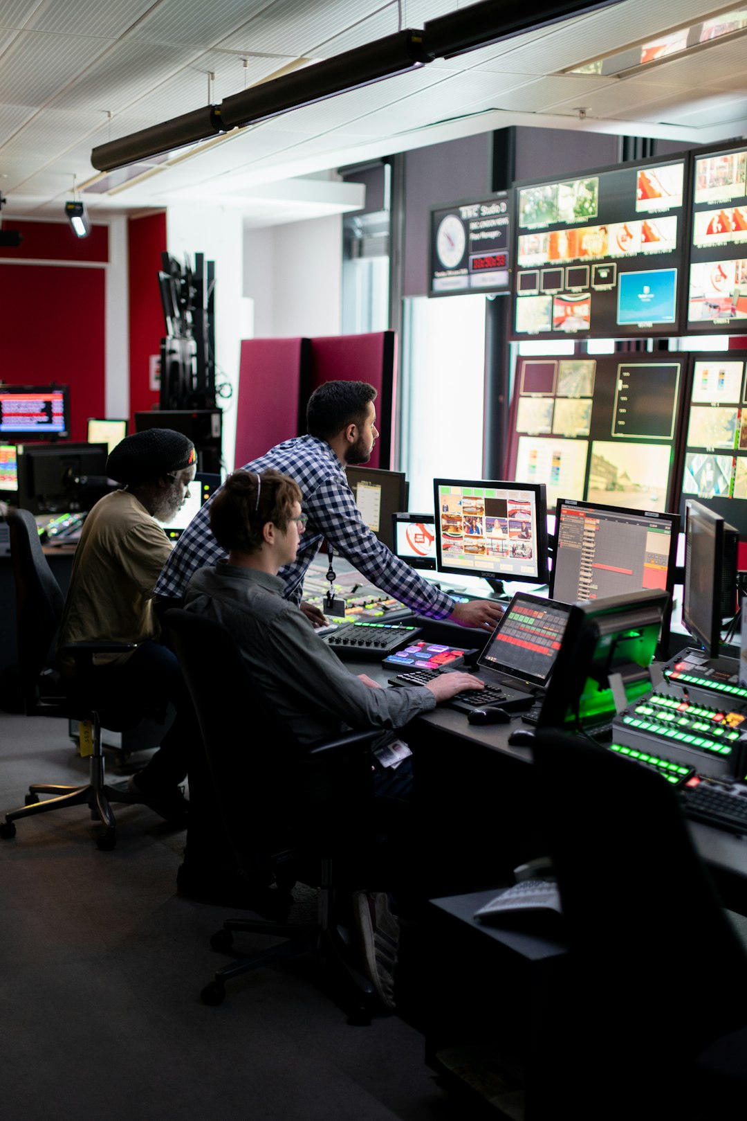 Broadcast engineers work in studio